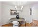 Dining room with modern chandelier, wainscotting, and decor at 1634 Ponce De Leon Ne Ave # 514, Atlanta, GA 30307