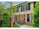 Charming home featuring brick accents, black shutters, and a well-manicured yard, exuding curb appeal at 1634 Ponce De Leon Ne Ave # 514, Atlanta, GA 30307
