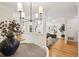 Bright living room with hardwood floors and neutral decor leading to the dining room at 1634 Ponce De Leon Ne Ave # 514, Atlanta, GA 30307
