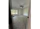 This bedroom features neutral colors, a ceiling fan, and natural light at 1962 Compton Se Dr, Atlanta, GA 30315