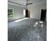 Spacious bedroom with natural lighting, neutral carpet, ceiling fan and open doorway at 1962 Compton Se Dr, Atlanta, GA 30315