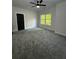 This bedroom features neutral colors, a ceiling fan, and natural light at 1962 Compton Se Dr, Atlanta, GA 30315