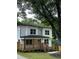 Inviting two-story home with a charming porch and beautifully landscaped front yard at 1962 Compton Se Dr, Atlanta, GA 30315