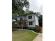 Beautifully renovated two-story home with a front porch and fresh landscaping at 1962 Compton Se Dr, Atlanta, GA 30315