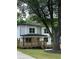 Attractive two-story home featuring a cozy front porch and well-maintained lawn at 1962 Compton Se Dr, Atlanta, GA 30315