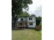 Stylish two-story home featuring a welcoming front porch and mature trees at 1962 Compton Se Dr, Atlanta, GA 30315