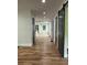 Hallway featuring new hardwood floors, recessed lighting, and stylish doors at 1962 Compton Se Dr, Atlanta, GA 30315