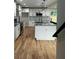 Bright, newly renovated kitchen with modern stainless appliances, granite counters and hardwood floors at 1962 Compton Se Dr, Atlanta, GA 30315
