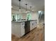 Kitchen island with stainless steel appliances, granite countertops, and ample lighting at 1962 Compton Se Dr, Atlanta, GA 30315