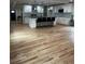 Open kitchen featuring a large island, modern lighting, and stainless steel appliances at 1962 Compton Se Dr, Atlanta, GA 30315