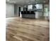 Open kitchen with a large island, pendant lighting, and hardwood floors throughout at 1962 Compton Se Dr, Atlanta, GA 30315