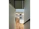 View of modern kitchen with white cabinets, granite counters, stainless appliances and hardwood floors at 1962 Compton Se Dr, Atlanta, GA 30315