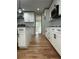 Gourmet kitchen with stylish white cabinets, granite countertops, and hardwood floors at 1962 Compton Se Dr, Atlanta, GA 30315