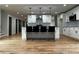 A well-lit kitchen featuring a large island, pendant lighting, and open floor plan at 1962 Compton Se Dr, Atlanta, GA 30315