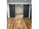 Open living room with modern barn door accents and beautiful hardwood floors at 1962 Compton Se Dr, Atlanta, GA 30315