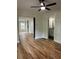 Inviting living room featuring new hardwood floors and modern ceiling fan at 1962 Compton Se Dr, Atlanta, GA 30315