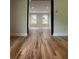 Bright living room with hardwood floors offering a seamless flow to other rooms at 1962 Compton Se Dr, Atlanta, GA 30315