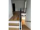 Modern staircase with hardwood floors and iron railings leads to the lower level at 1962 Compton Se Dr, Atlanta, GA 30315