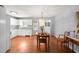 Eat-in kitchen showcasing white cabinets, granite countertops, and dining area at 3016 Ansley Manor Ct, Snellville, GA 30078