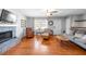 Cozy living room features hardwood floors, a stone fireplace, and ample seating at 3016 Ansley Manor Ct, Snellville, GA 30078