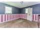 Bedroom with pink and blue stripes and a broken door at 3133 Cottonwood Se Dr, Atlanta, GA 30316