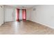 Bright living room with laminate floors, natural light, and exterior access at 3133 Cottonwood Se Dr, Atlanta, GA 30316