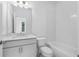 Clean bathroom with tub and shower combo, single vanity, and modern lighting at 334 Olmstead Way # 37, Alpharetta, GA 30022