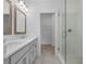 Bright bathroom features a double vanity, glass shower door, and a walk-in closet at 334 Olmstead Way # 37, Alpharetta, GA 30022