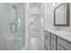 All white bathroom offers a tiled shower with glass door, double vanity and modern finishes at 334 Olmstead Way # 37, Alpharetta, GA 30022