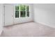 Cozy bedroom with plush carpeting, a large window, and plenty of natural light at 334 Olmstead Way # 37, Alpharetta, GA 30022