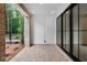 Spacious brick-paved patio featuring modern black-framed sliding glass doors and outdoor lighting at 334 Olmstead Way # 37, Alpharetta, GA 30022