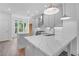 Modern kitchen featuring stainless steel appliances, a large island, and white quartz countertops at 334 Olmstead Way # 37, Alpharetta, GA 30022