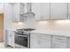 Modern kitchen features stainless steel appliances and white cabinetry and subway tile backsplash at 334 Olmstead Way # 37, Alpharetta, GA 30022