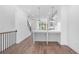 Open concept kitchen and dining area featuring stainless appliances, island and hardwood flooring at 334 Olmstead Way # 37, Alpharetta, GA 30022