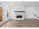 Bright living room with wood floors and fireplace at 334 Olmstead Way # 37, Alpharetta, GA 30022