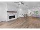 Open concept living room with fireplace and view to kitchen at 334 Olmstead Way # 37, Alpharetta, GA 30022