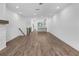 Open concept living room with fireplace and view to kitchen at 334 Olmstead Way # 37, Alpharetta, GA 30022