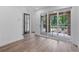 Living room with hardwood floors leading to outdoor patio through sliding glass doors at 334 Olmstead Way # 37, Alpharetta, GA 30022