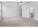 Large primary bedroom with carpet and neutral walls at 334 Olmstead Way # 37, Alpharetta, GA 30022