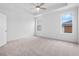 Spacious primary bedroom with carpet, ceiling fan, and tray ceiling at 334 Olmstead Way # 37, Alpharetta, GA 30022