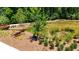 Scenic view of a community pond with walking path and unique metal ant statue in a landscaped setting at 334 Olmstead Way # 37, Alpharetta, GA 30022