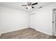 Comfortable bedroom featuring a ceiling fan, wood-look flooring, a closet, and neutral wall color at 6658 Collins Ct, Riverdale, GA 30274