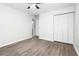 Bedroom with a ceiling fan, wood-look flooring, closet, and neutral walls create a peaceful retreat at 6658 Collins Ct, Riverdale, GA 30274