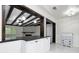 Kitchen with bar top and view of a living room with beautiful fireplace at 6658 Collins Ct, Riverdale, GA 30274