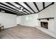 Cozy living room with a stone fireplace and stylish flooring at 6658 Collins Ct, Riverdale, GA 30274