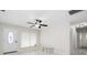 Bright living room featuring tile floors, large window, and a glass coffee table at 6658 Collins Ct, Riverdale, GA 30274
