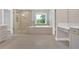 Bright bathroom with glass shower, soaking tub, double sink vanity, and neutral color palette at 1065 Low Water Crossing Nw, Acworth, GA 30101