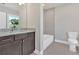 Bathroom featuring granite countertops, dark cabinetry and a tiled shower at 1065 Low Water Crossing Nw, Acworth, GA 30101