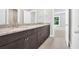Bathroom showcasing double vanities, granite countertops, and a tiled shower at 1065 Low Water Crossing Nw, Acworth, GA 30101