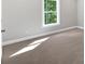 Bedroom featuring neutral carpet and a window with natural light at 1065 Low Water Crossing Nw, Acworth, GA 30101